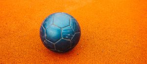 Soccer Ball on Orange Pitch