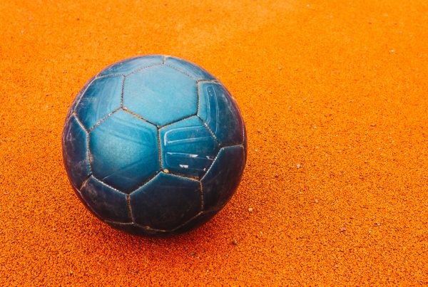 Soccer Ball on Orange Pitch